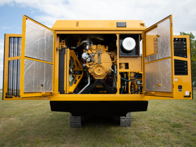 The open hatch of a Vermeer low speed shredder showing how operators access important maintenance features