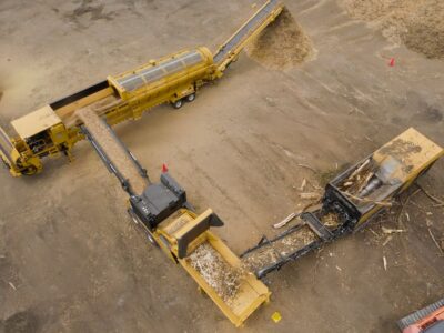 An aerial shot of shredders and grinders processing wood waste