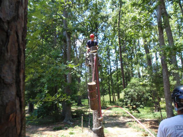 Climber using safe practices while performing basic rigging operations.