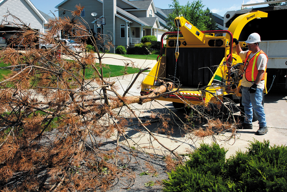 Vermeer BC1200XL brush chipper in action