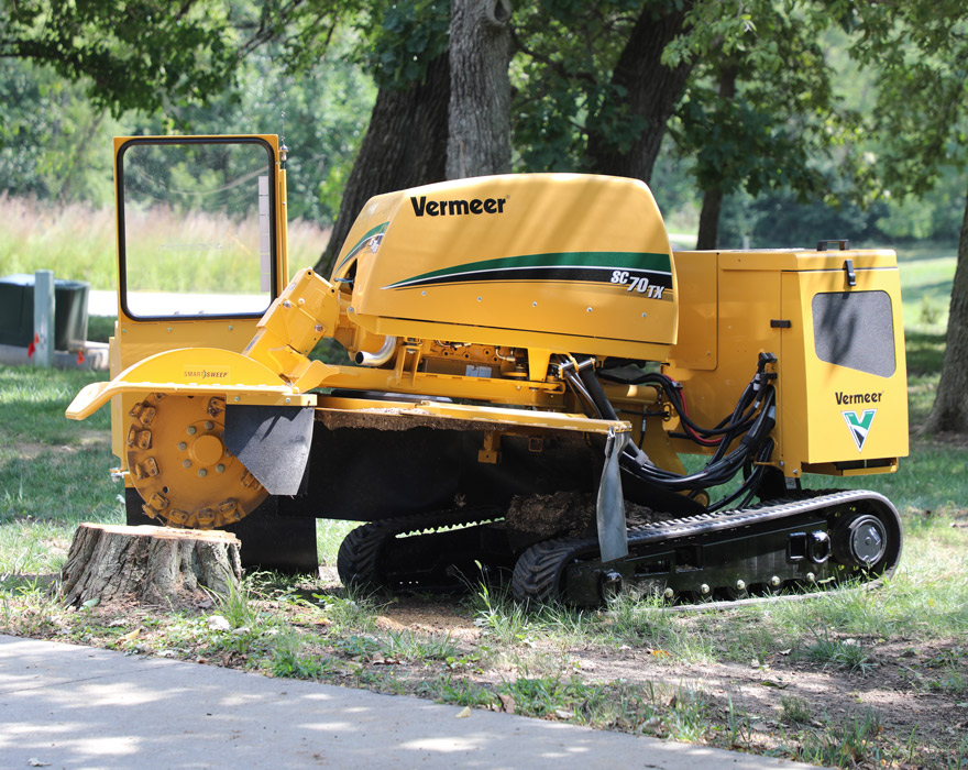 A stump grinder sits on a stump waiting to be used