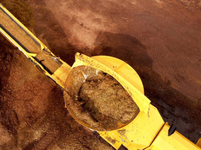 An aerial shot of a horizontal tub grinder working on the job site