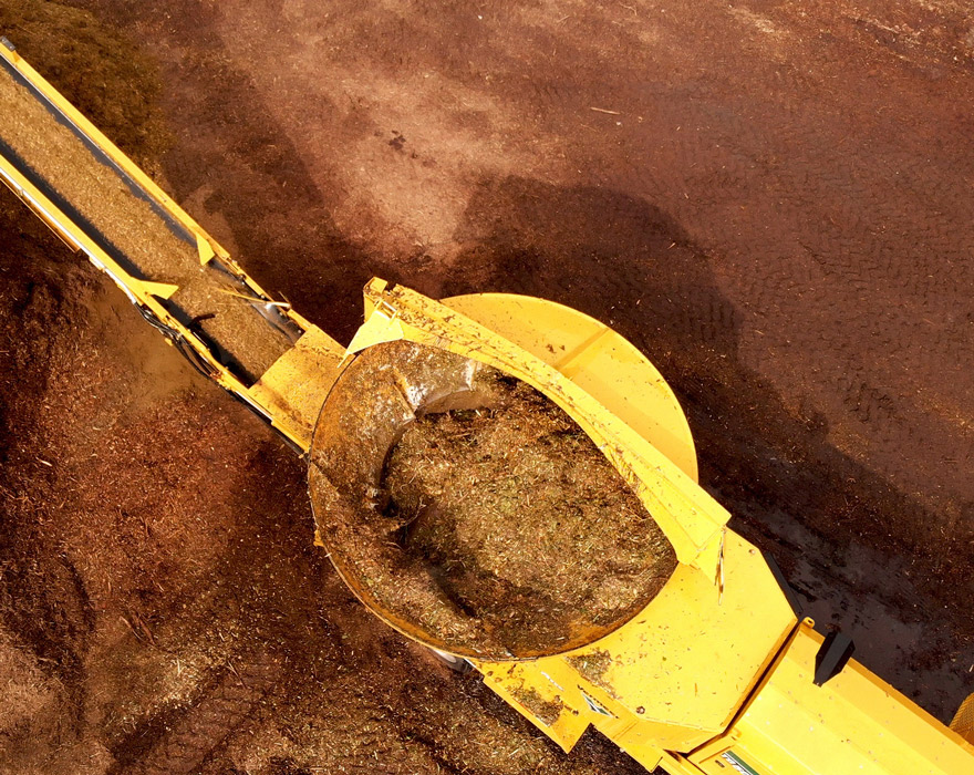 An aerial shot of a horizontal tub grinder working on the job site