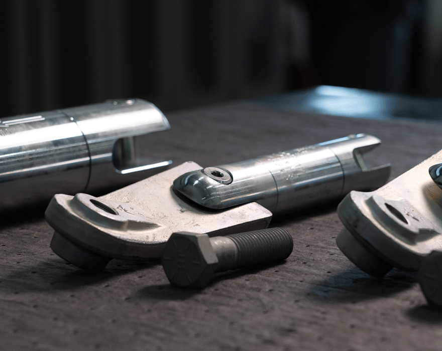 An image of multiple wrenches and tools laying down on a bench