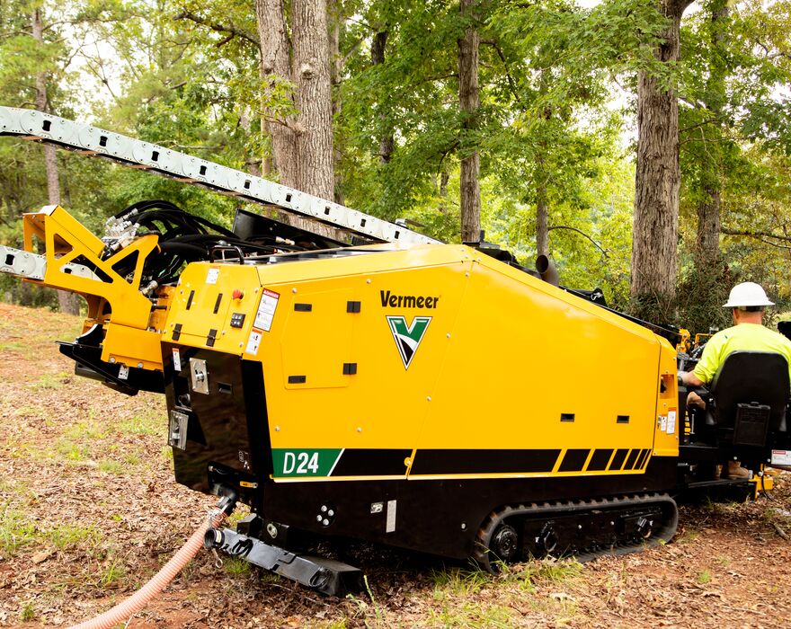 A man sitting on a D24 directional drill