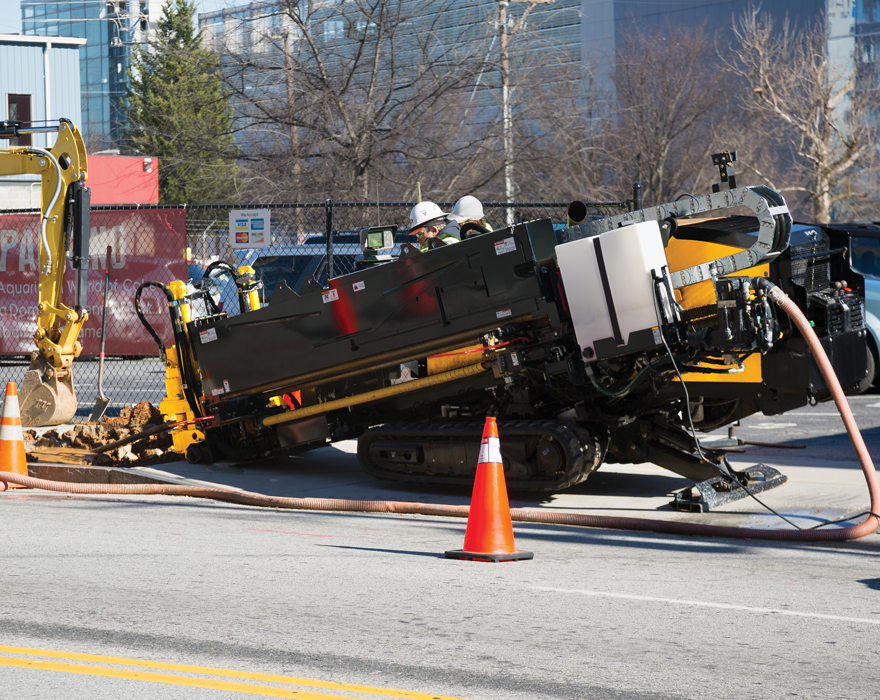 A horizontal directional drill on a jobsite in a city