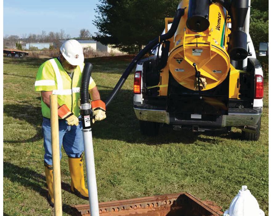 Vermeer ECO25 vacuum excavator working next to a fire hydrant. The vacuum excavator fits in a truck bed.